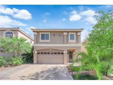 Charming two-story home with a large two-car garage and beautiful desert landscaping at 5234 Tulip Hill Ave, Las Vegas, NV 89141