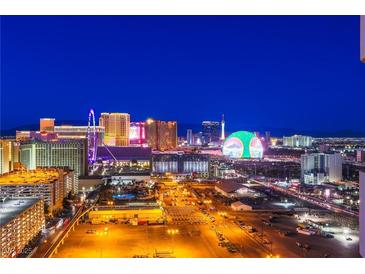 Breathtaking night view of the illuminated Las Vegas strip showcasing the resorts and the high roller observation wheel at 125 E Harmon Ave # 2801 & 2803, Las Vegas, NV 89109