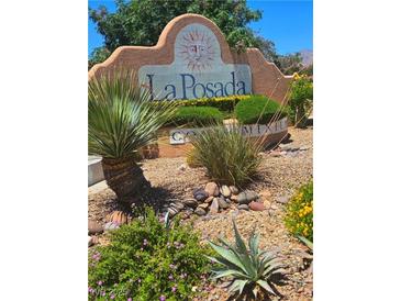 La Posada community entrance sign featuring lush landscaping with desert plants and decorative stones on a sunny day at 1908 Rio Canyon Ct # 105, Las Vegas, NV 89128