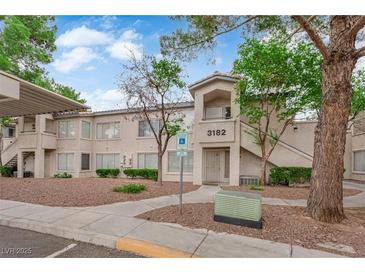 Inviting condo building with well-maintained landscaping, accessible parking, and charming exterior details at 3182 Tarpon Dr # 204, Las Vegas, NV 89120