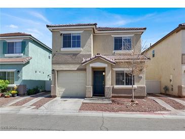 Charming two-story home with a well-maintained yard and inviting entrance, perfect for a Gathering at 5200 Paradise Skies Ave, Las Vegas, NV 89156