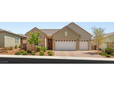 Charming single-story home with stone accents, three-car garage, and well-manicured front yard at 3391 Stone View Ave, Henderson, NV 89044