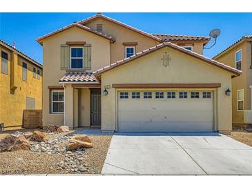 Two-story home with tan siding, desert landscaping, a two-car garage, and a tile roof at 3437 Visionary Bay Ave, North Las Vegas, NV 89081