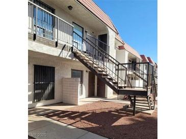 Two-story townhouse with private entrance, accessible by outdoor staircase at 4300 N Lamont St # 232, Las Vegas, NV 89115