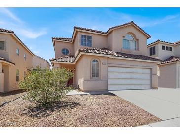 Charming two-story home featuring a tile roof and a spacious two-car garage at 3359 Commendation Dr, Las Vegas, NV 89117