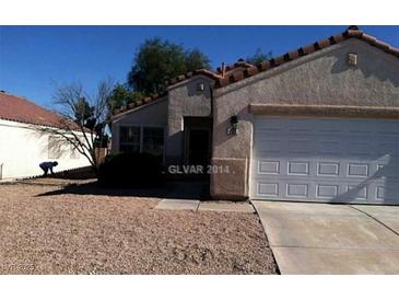 Charming single-story home featuring a desert landscape and a two-car garage at 733 Hitchen Post Dr, Henderson, NV 89011