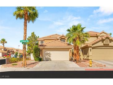 Charming two-story home featuring a tile roof, well-kept landscaping, and a spacious two-car garage at 1125 Lumina Ct, Las Vegas, NV 89117