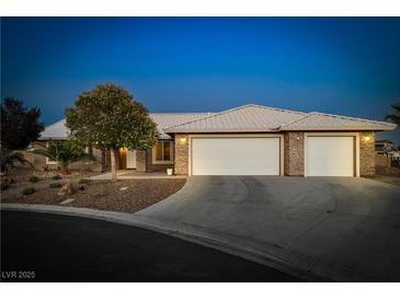 Charming single-story home with well-maintained landscaping and a three-car garage at 231 Bristle Cone, Pahrump, NV 89048