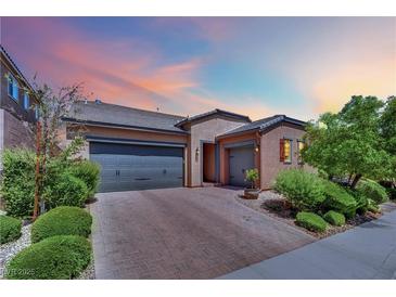Charming single story home featuring a two-car garage and desert landscaping at 333 Mandarin Hill Ln, Henderson, NV 89012