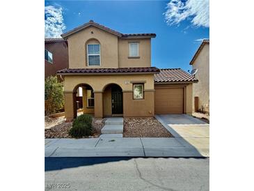 Charming two-story home featuring a tile roof, covered entryway, and attached garage on a sunny day at 12021 Spice Tree St, Las Vegas, NV 89183