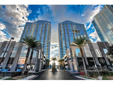 Striking exterior view of the Panorama Towers in Las Vegas with sleek, modern architecture and palm tree landscaping at 4525 Dean Martin Dr # 412, Las Vegas, NV 89103