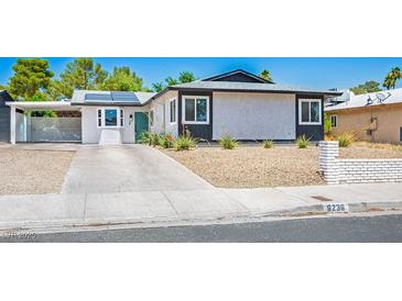 Charming single-story home featuring a covered carport, desert landscaping, and modern solar panels at 6236 Foothill Blvd, Las Vegas, NV 89118