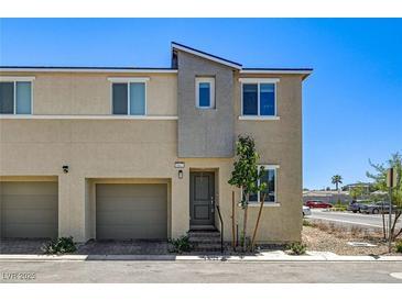 Charming two-story townhome featuring a private garage and modern architectural details at 5617 Craftsman Ave, Las Vegas, NV 89122