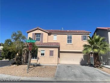 Charming two-story home with a well-maintained front yard and a spacious two-car garage at 8089 Windmill Villa St, Las Vegas, NV 89139