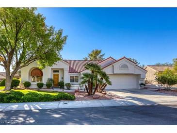 Charming single-story home with manicured lawn, desert landscaping, and a two-car garage at 9201 Yucca Blossom Dr, Las Vegas, NV 89134