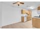 Efficient kitchen with light wood cabinets and modern appliances at 4730 Craig Rd # 2036, Las Vegas, NV 89115