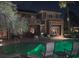 The backyard features a pool and the house has stone accents at 2200 Purple Majesty Ct, Las Vegas, NV 89117