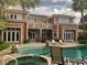 The backyard features a pool and the house has stone accents at 2200 Purple Majesty Ct, Las Vegas, NV 89117
