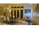 Elegant dining room with decorative lighting and neutral color palette at 2200 Purple Majesty Ct, Las Vegas, NV 89117
