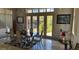 Dining room with large windows and a modern dining set at 2200 Purple Majesty Ct, Las Vegas, NV 89117