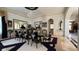 A formal dining room with a large table set for many guests at 2200 Purple Majesty Ct, Las Vegas, NV 89117