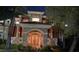 Stately home featuring a stone archway leading to the entrance and mature landscaping at 2200 Purple Majesty Ct, Las Vegas, NV 89117