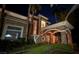 Beautiful home with stone accents, lush landscaping, and a grand entrance at 2200 Purple Majesty Ct, Las Vegas, NV 89117