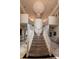 A grand staircase leads to a second story at 2200 Purple Majesty Ct, Las Vegas, NV 89117