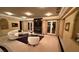 Bright living room with fireplace, neutral decor, and access to the outdoors at 2200 Purple Majesty Ct, Las Vegas, NV 89117