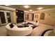 Stylish living room featuring modern furniture, fireplace, and large windows at 2200 Purple Majesty Ct, Las Vegas, NV 89117