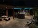Outdoor kitchen and patio with a granite bar and built in barbecue area at 2200 Purple Majesty Ct, Las Vegas, NV 89117