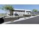 Contemporary home featuring xeriscaping and a modern facade with stone accents and desert landscaping at 652 Dragon Peak, Henderson, NV 89012