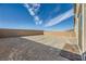 Spacious backyard with privacy wall and gravel, ready for landscaping and outdoor enjoyment at 2705 Cava Tirreni St, Henderson, NV 89044