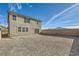 Sizeable backyard features a neutral-toned home, privacy wall, and stunning mountain views at 2705 Cava Tirreni St, Henderson, NV 89044
