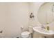 Clean and bright bathroom featuring a pedestal sink and modern fixtures at 2705 Cava Tirreni St, Henderson, NV 89044