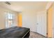 A bedroom featuring neutral carpet, a window, and a closet at 2705 Cava Tirreni St, Henderson, NV 89044
