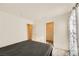 A bedroom featuring neutral carpet, a window, and a closet at 2705 Cava Tirreni St, Henderson, NV 89044