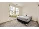Neutral bedroom featuring soft carpet, a natural-light window, and comfortable accommodations at 2705 Cava Tirreni St, Henderson, NV 89044