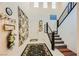 Bright foyer with soaring ceilings, stairway, and modern decor at 2705 Cava Tirreni St, Henderson, NV 89044
