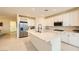 Modern kitchen with white cabinets, stainless steel appliances, and a large center island at 2705 Cava Tirreni St, Henderson, NV 89044