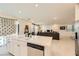 Spacious kitchen with white cabinets, stainless steel appliances, and open layout at 2705 Cava Tirreni St, Henderson, NV 89044