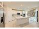 Bright kitchen featuring white cabinets, marble countertops, and stainless steel appliances at 2705 Cava Tirreni St, Henderson, NV 89044
