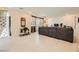 Open-concept living room with tile floors and comfortable seating at 2705 Cava Tirreni St, Henderson, NV 89044