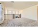Upstairs loft featuring railings, neutral carpet, and great natural lighting at 2705 Cava Tirreni St, Henderson, NV 89044