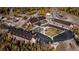 Aerial view of a large complex with multiple buildings, parking, and green space at 223 Hunter Ridge Rd # A202, Brian Head, UT 84719