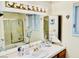 Bathroom featuring double vanity, tile countertop, and shower/tub combination at 2605 S Durango Dr # 204, Las Vegas, NV 89117