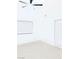 Bright, minimalist bedroom with neutral carpet and a large window at 2605 S Durango Dr # 204, Las Vegas, NV 89117