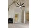 Bright living room featuring vaulted ceilings, fireplace, and modern ceiling fan at 2605 S Durango Dr # 204, Las Vegas, NV 89117