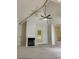 Bright living room with vaulted ceilings, fireplace, and modern ceiling fan at 2605 S Durango Dr # 204, Las Vegas, NV 89117