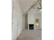 Spacious living room featuring vaulted ceilings, fireplace, and neutral carpet at 2605 S Durango Dr # 204, Las Vegas, NV 89117